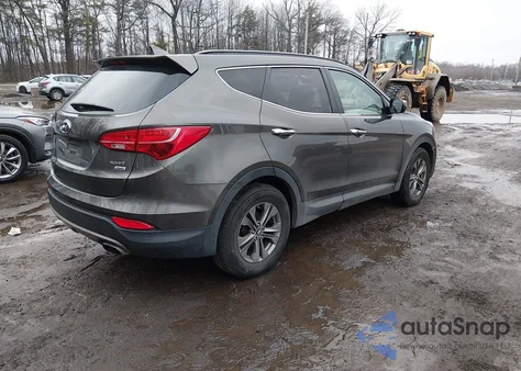 2014 Hyundai Santa Fe Sport 2.4L z USA, uszkodzony, nr VIN 5XYZUDLB1EG206574